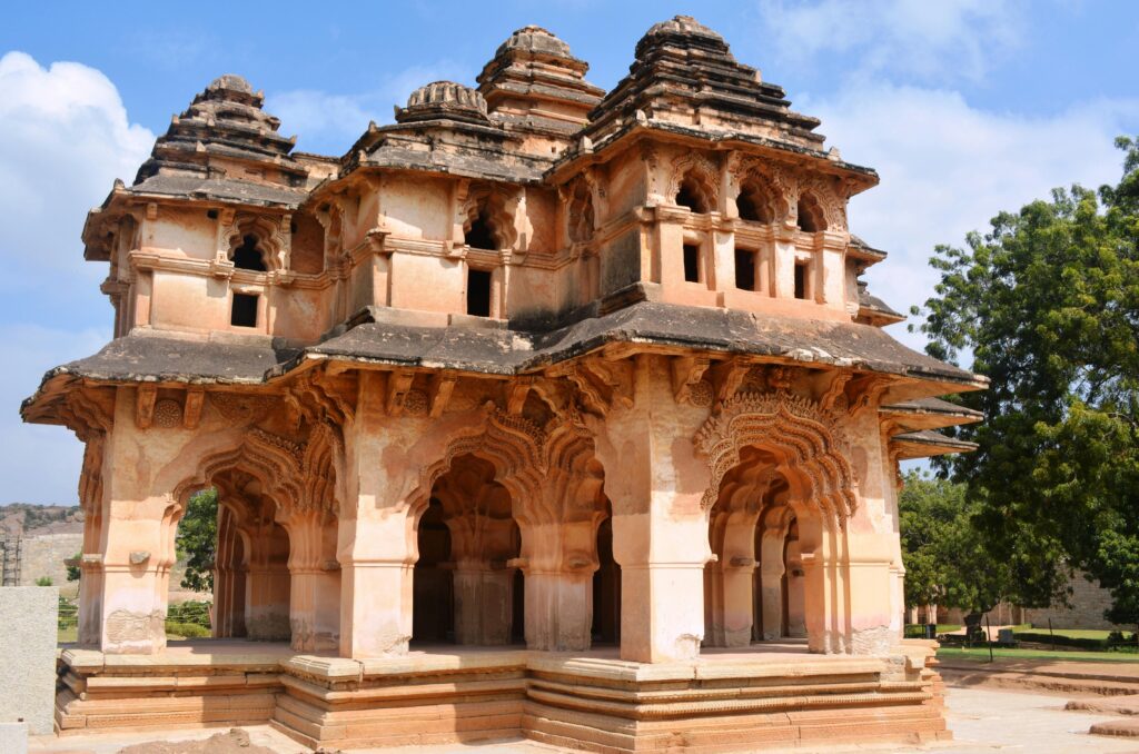 Beautiful view of the historic Lotus Mahal in Hampi, India, with intricate architecture.